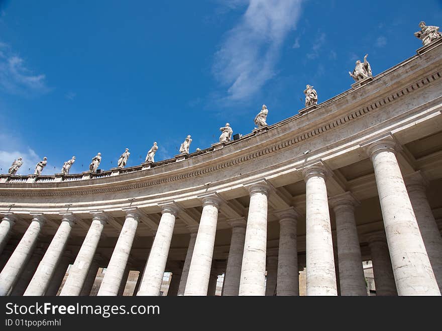 Religious Catholicism sculpture on roof against blue sky. Religious Catholicism sculpture on roof against blue sky