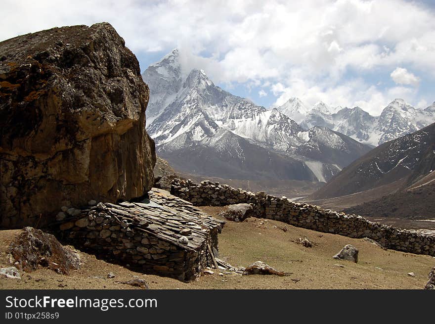 Ama Dablam is a mountain in the Himalaya range of eastern Nepal. The main peak is 6,812 metres (22,349 ft), the lower western peak is 5,563 metres (18,251 ft). Ama Dablam means Mother and Pearl Necklace. Ama Dablam is a mountain in the Himalaya range of eastern Nepal. The main peak is 6,812 metres (22,349 ft), the lower western peak is 5,563 metres (18,251 ft). Ama Dablam means Mother and Pearl Necklace