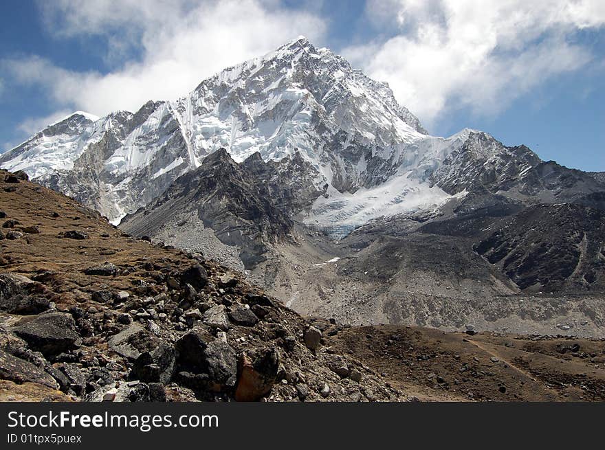 Ama Dablam is a mountain in the Himalaya range of eastern Nepal. The main peak is 6,812 metres (22,349 ft), the lower western peak is 5,563 metres (18,251 ft). Ama Dablam means Mother and Pearl Necklace. Ama Dablam is a mountain in the Himalaya range of eastern Nepal. The main peak is 6,812 metres (22,349 ft), the lower western peak is 5,563 metres (18,251 ft). Ama Dablam means Mother and Pearl Necklace