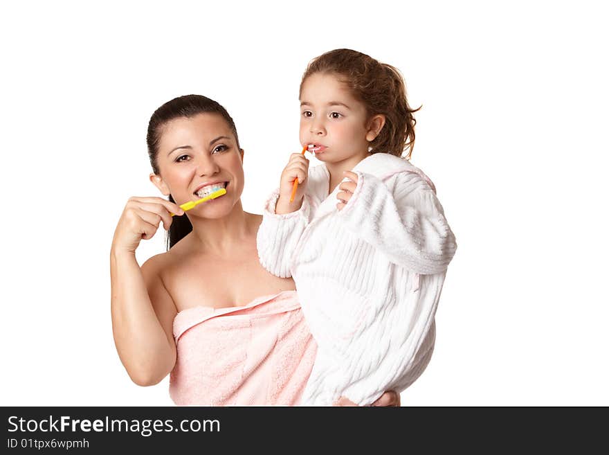 A mother and daughter brushing teeth using toothbrushes and aqua coloured mint flavoured toothpaste.