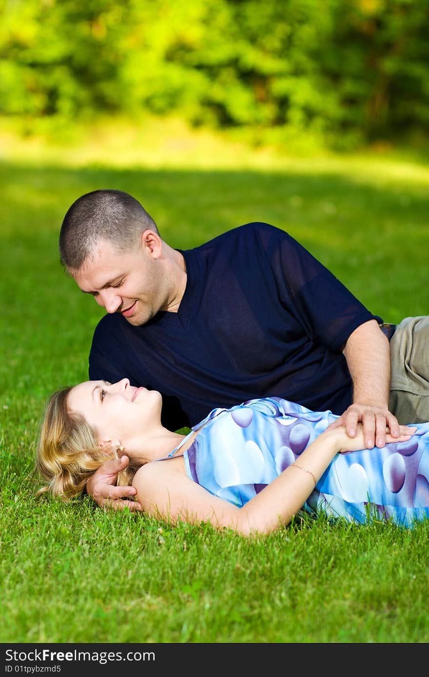 Attractive couple together on meadow