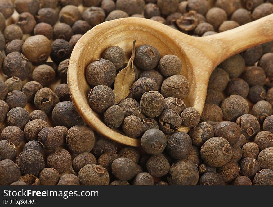 Aromatic pepper in wooden spoon. Aromatic pepper in wooden spoon