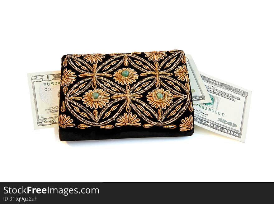 Embroidered woman's purse and dollar banknotes isolated. Embroidered woman's purse and dollar banknotes isolated