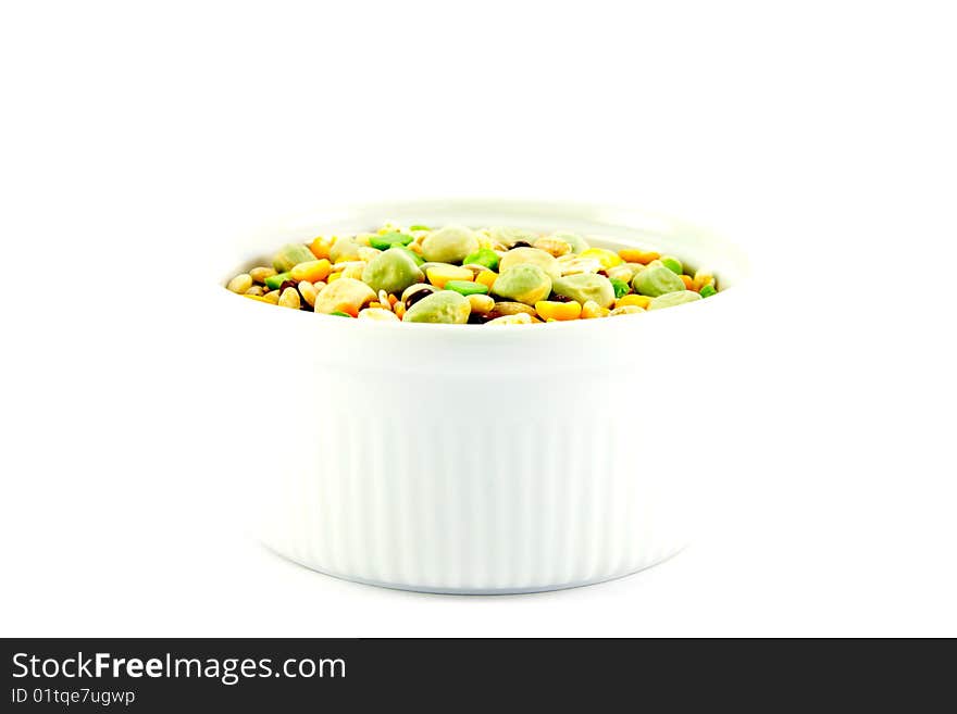 Assorted soup pulses in a small round dish with a white background