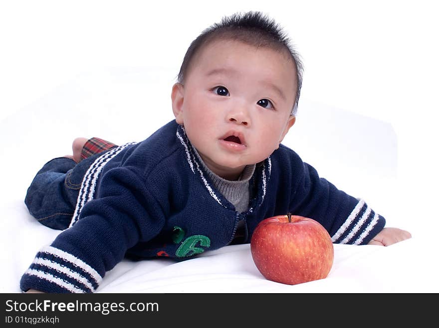 A baby sitting on the white background. A baby sitting on the white background