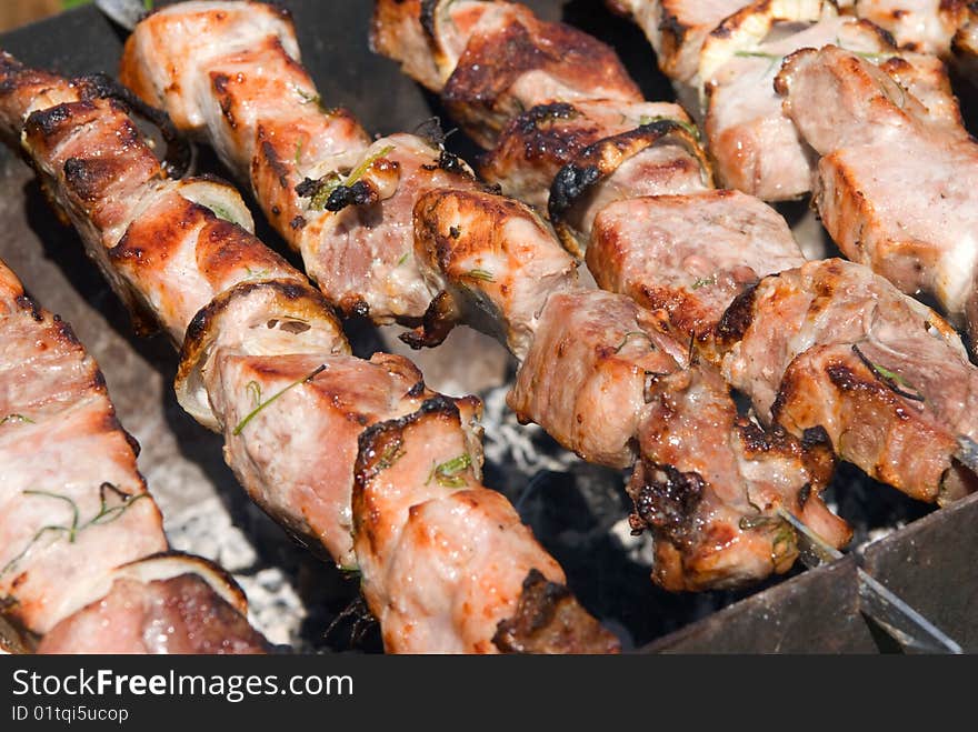 Shish kebab preparation on a brazier.