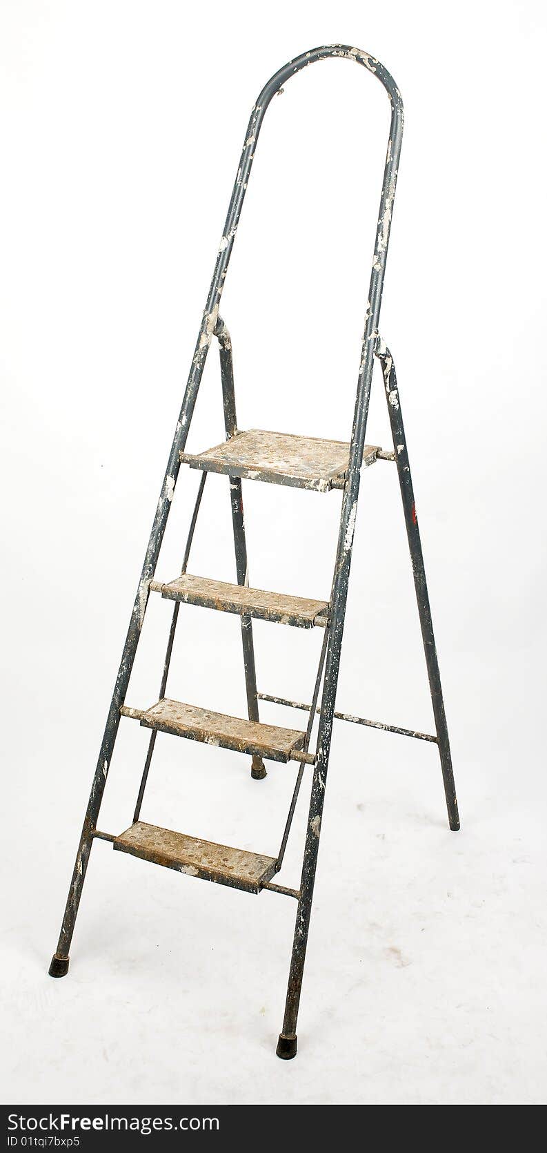 Dirty aluminum ladder on dirty white paper