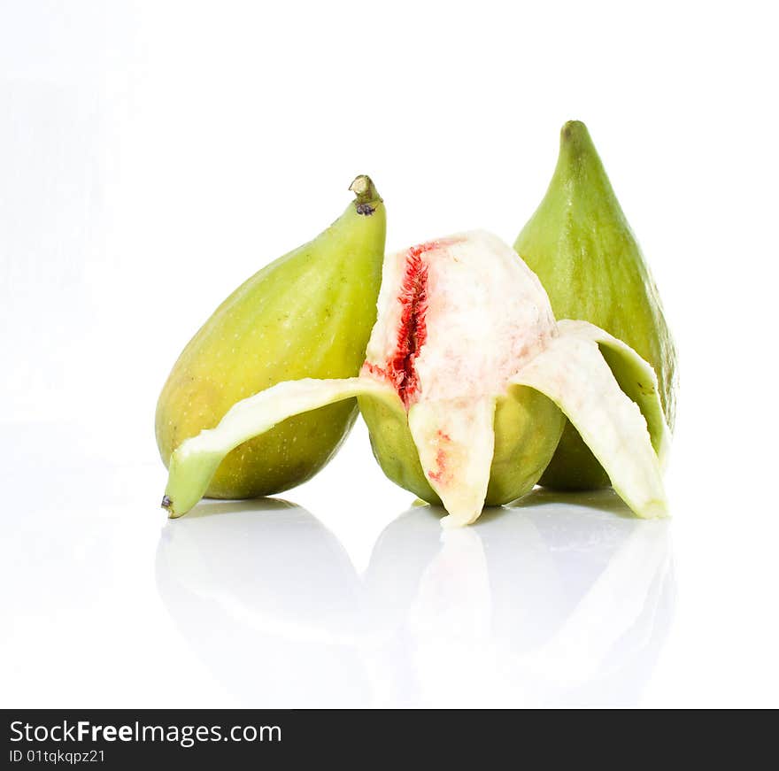 Pealed fig fruit on white backround