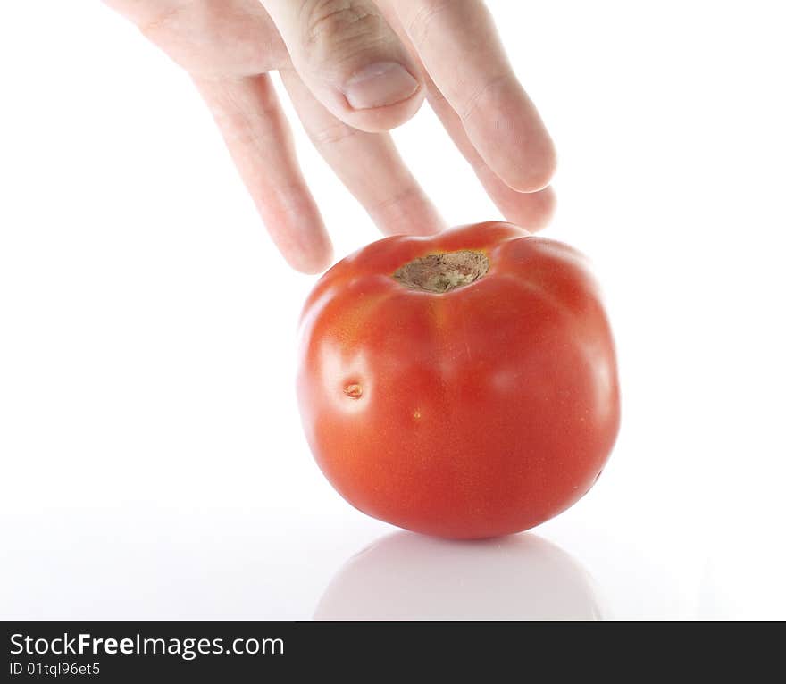 Reaching for a tomato on white backround