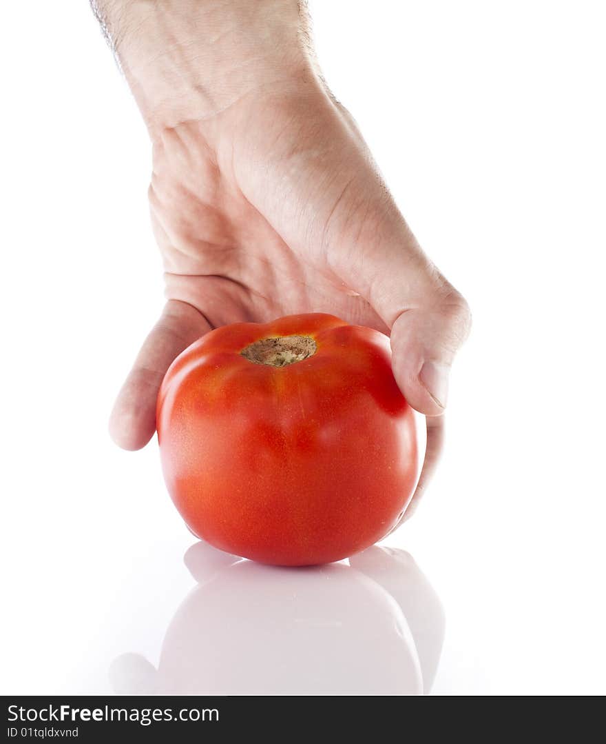 Reaching for a tomato on white backround