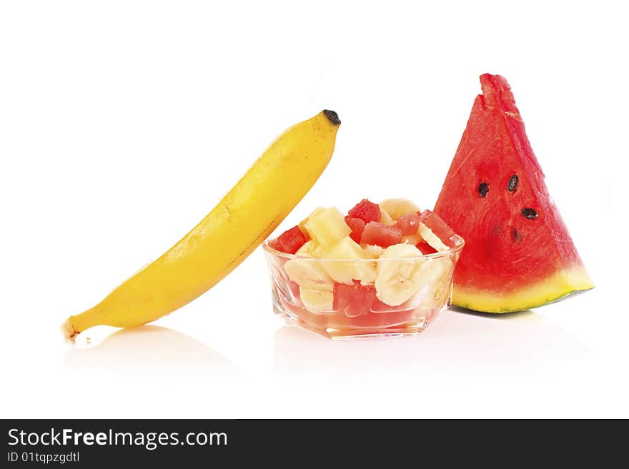 Fresh summer fruit salad on white backround