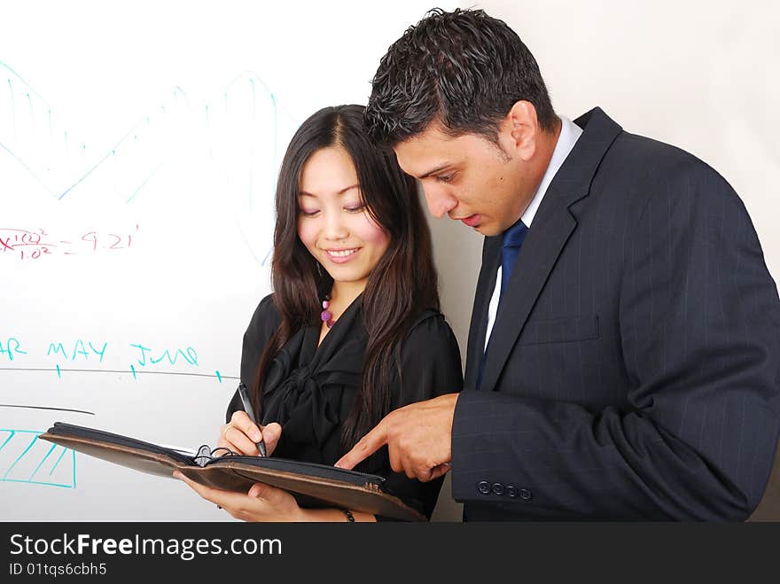 Students at whiteboard discussing