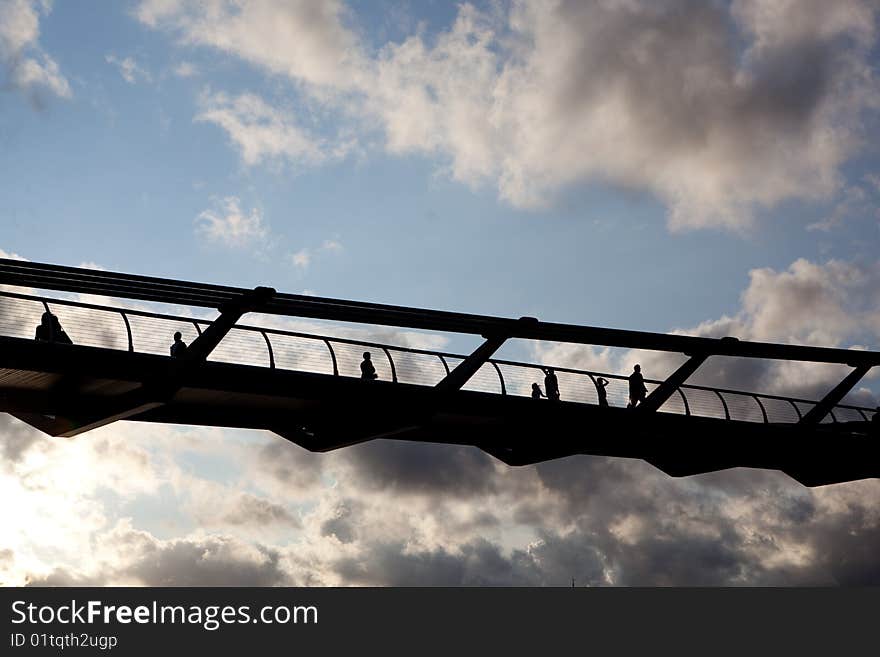 Shadows of people on a high bridge. Shadows of people on a high bridge