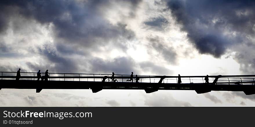 Shadows of people on a high bridge. Shadows of people on a high bridge