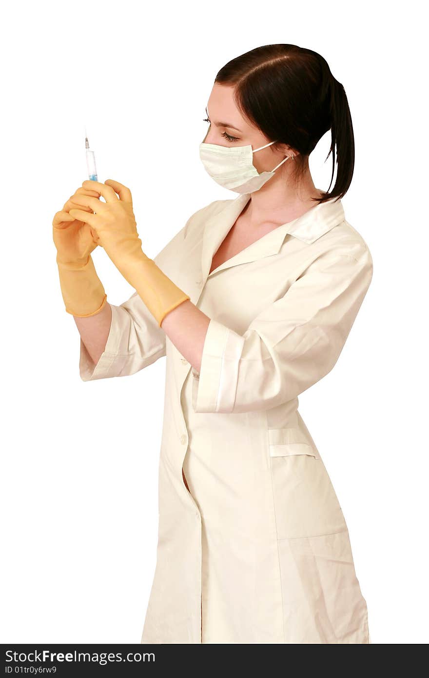 Doctor in a white robe and a mask with syringe