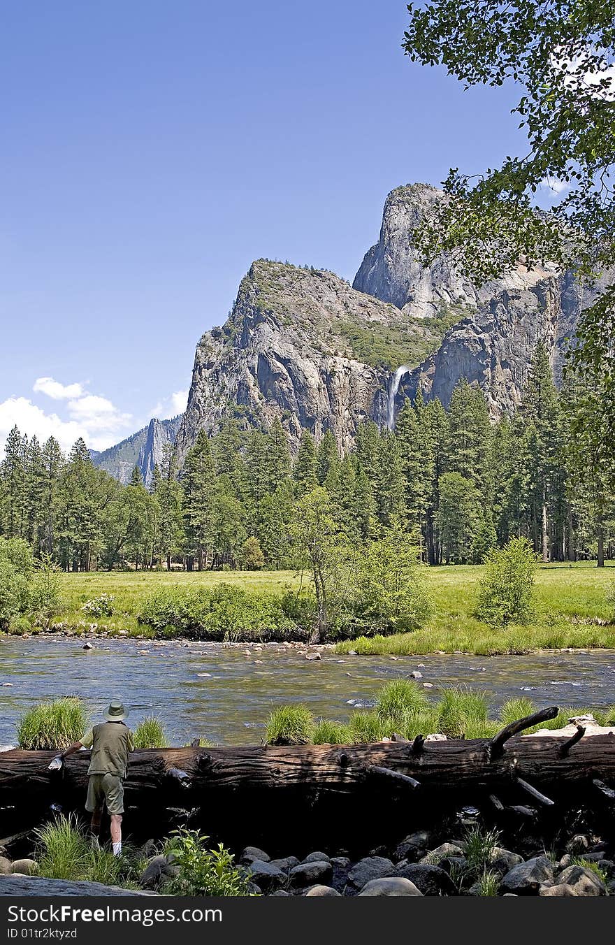 View of Yosemite Valley with a River in the foreground and Mountains in the background. View of Yosemite Valley with a River in the foreground and Mountains in the background