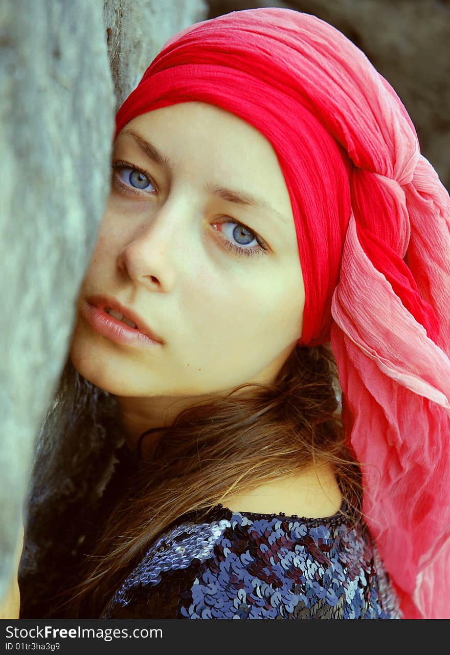 Portrait Of Lovely Woman In Scarf