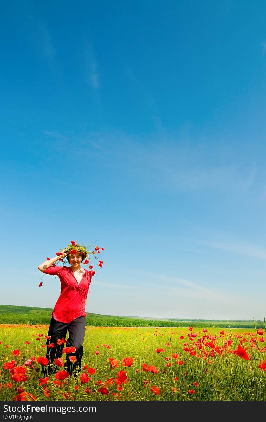 Girl stands in poppy field. Girl stands in poppy field