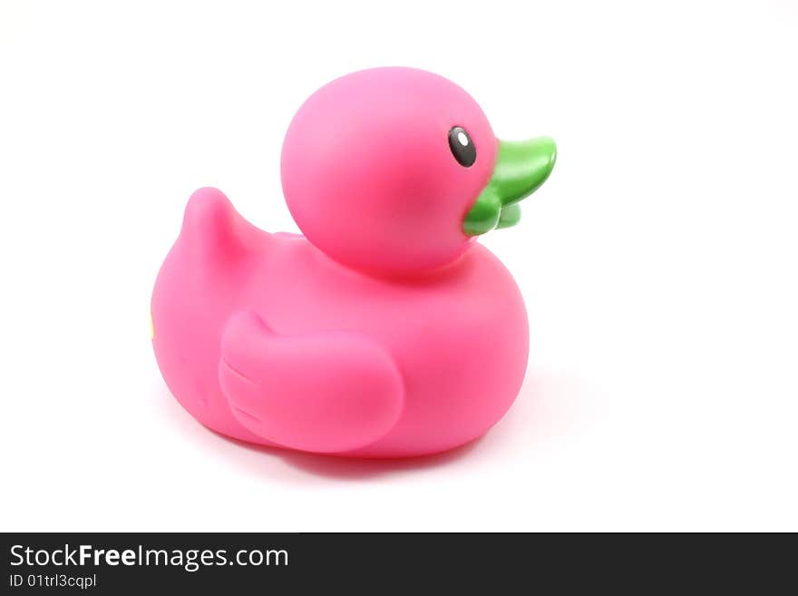 A purple toy duck on a white background.