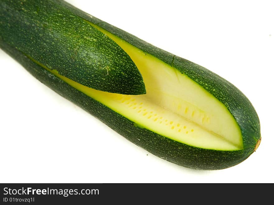 Quartered zucchini on white background