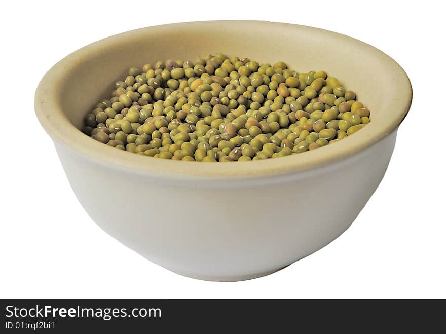 Dry split peas in ceramic bowl isolated over white