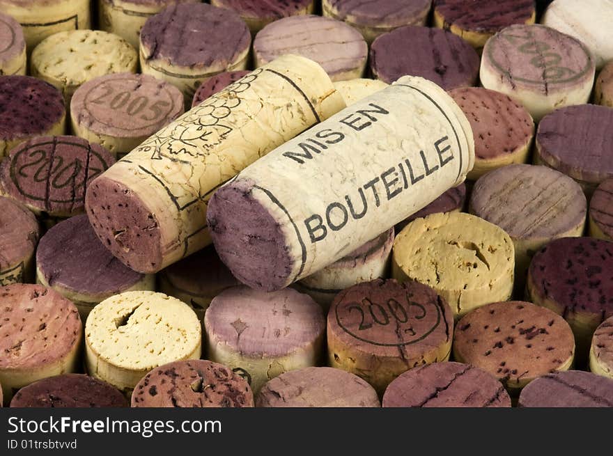 Mis en bouteille printed cork on a background of wine stoppers.