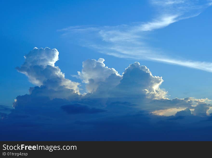 White clouds and the blue sky in the sunset. White clouds and the blue sky in the sunset