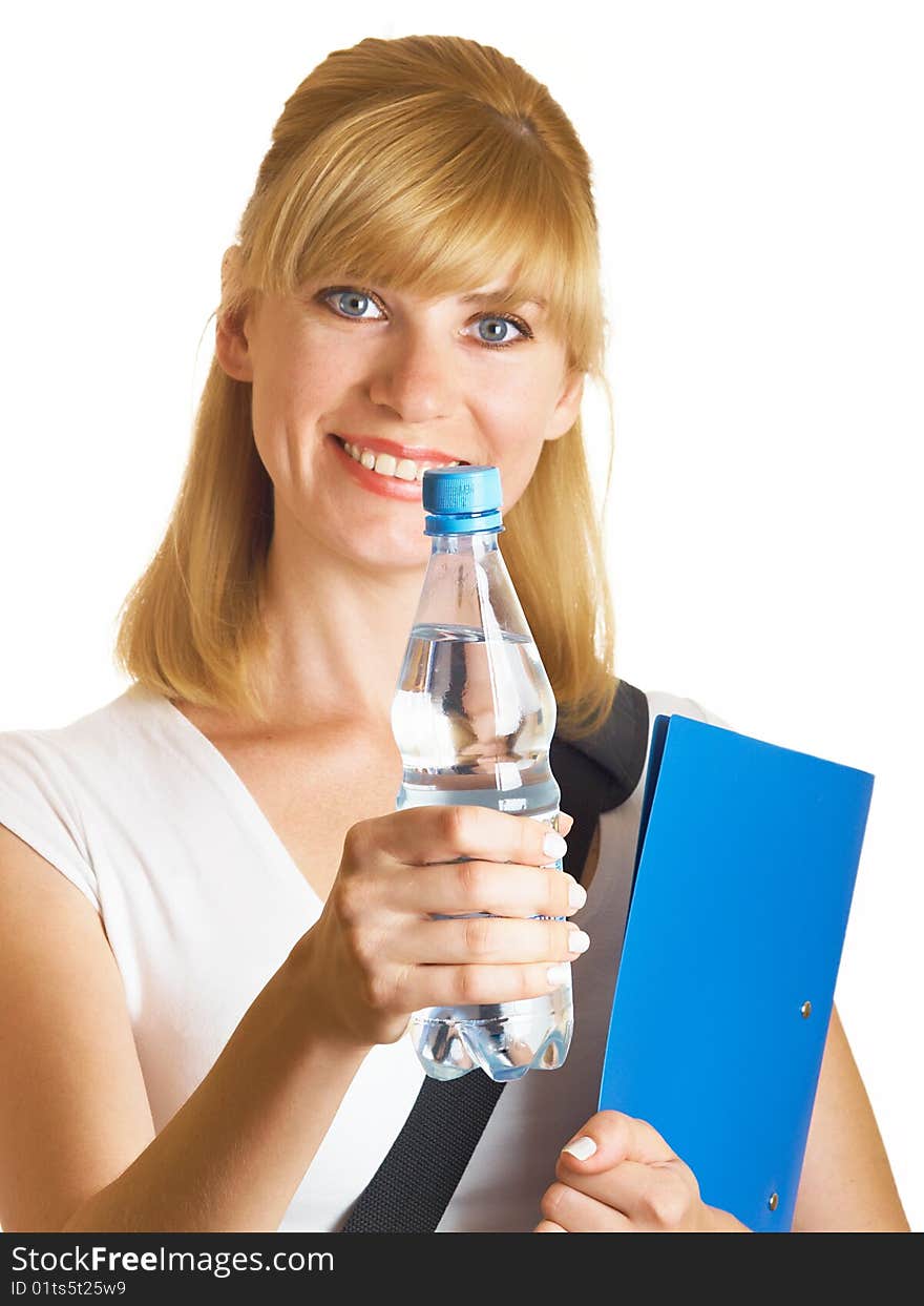 The young student holds a bottle with water on a white background. The young student holds a bottle with water on a white background