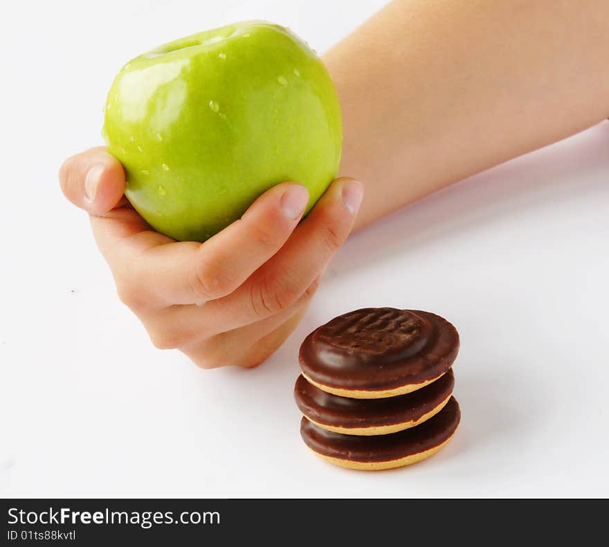 Healthy lifestyle - choosing between apple and cookie