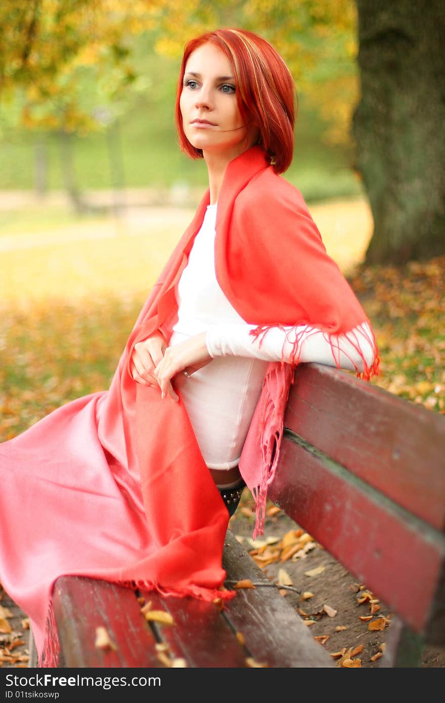 Young girl relaxing in autumn park. Young girl relaxing in autumn park