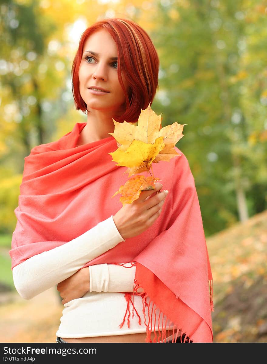 Young girl walking in autumn park. Young girl walking in autumn park