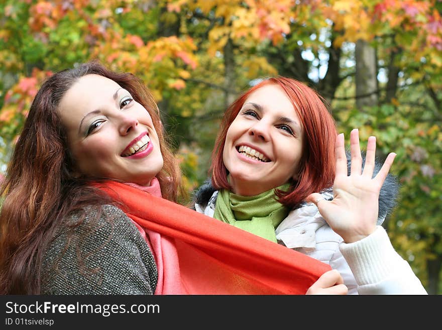 Two young girls having fun in park