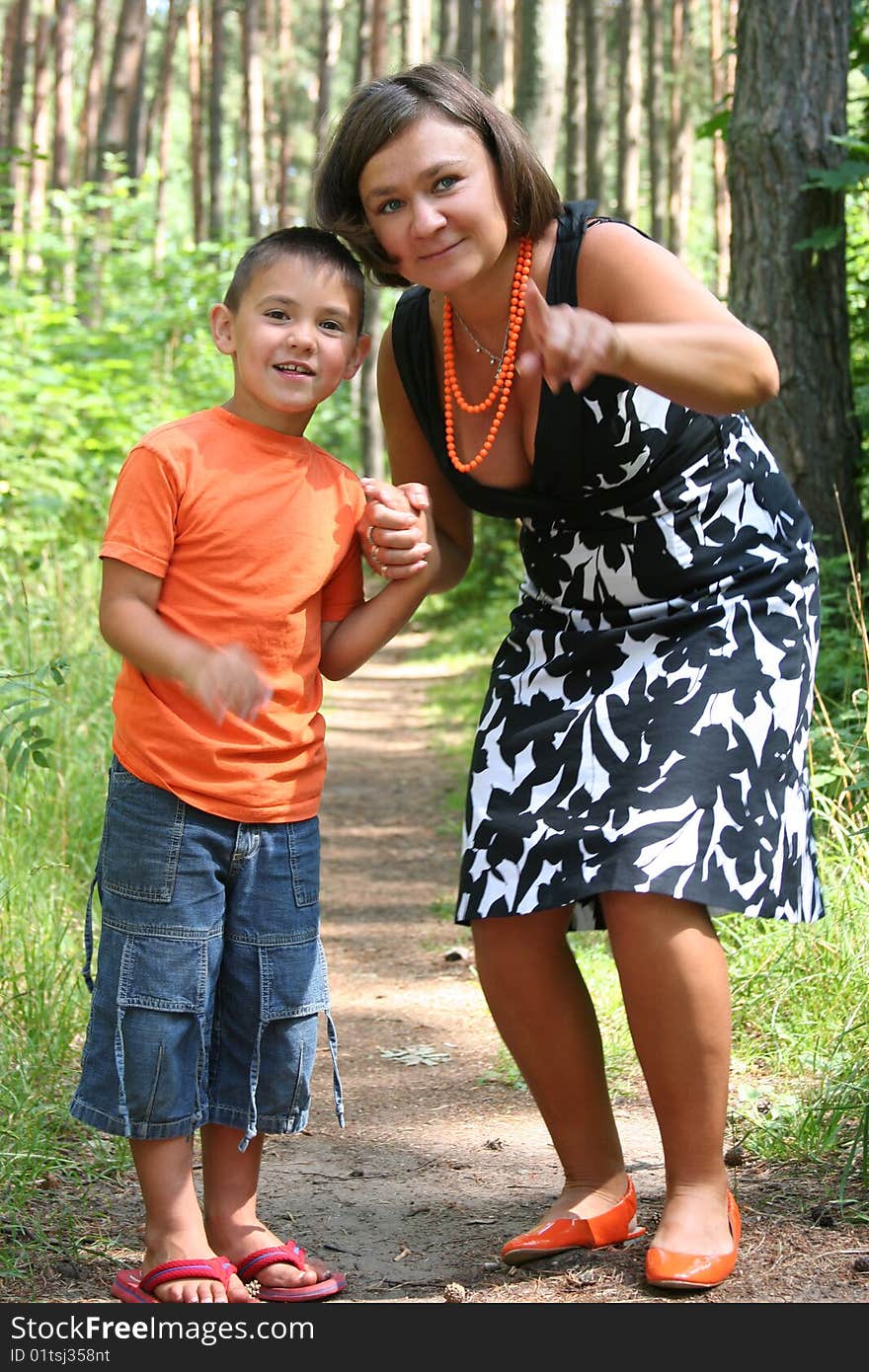 Mother with son walking in the forest. Mother with son walking in the forest