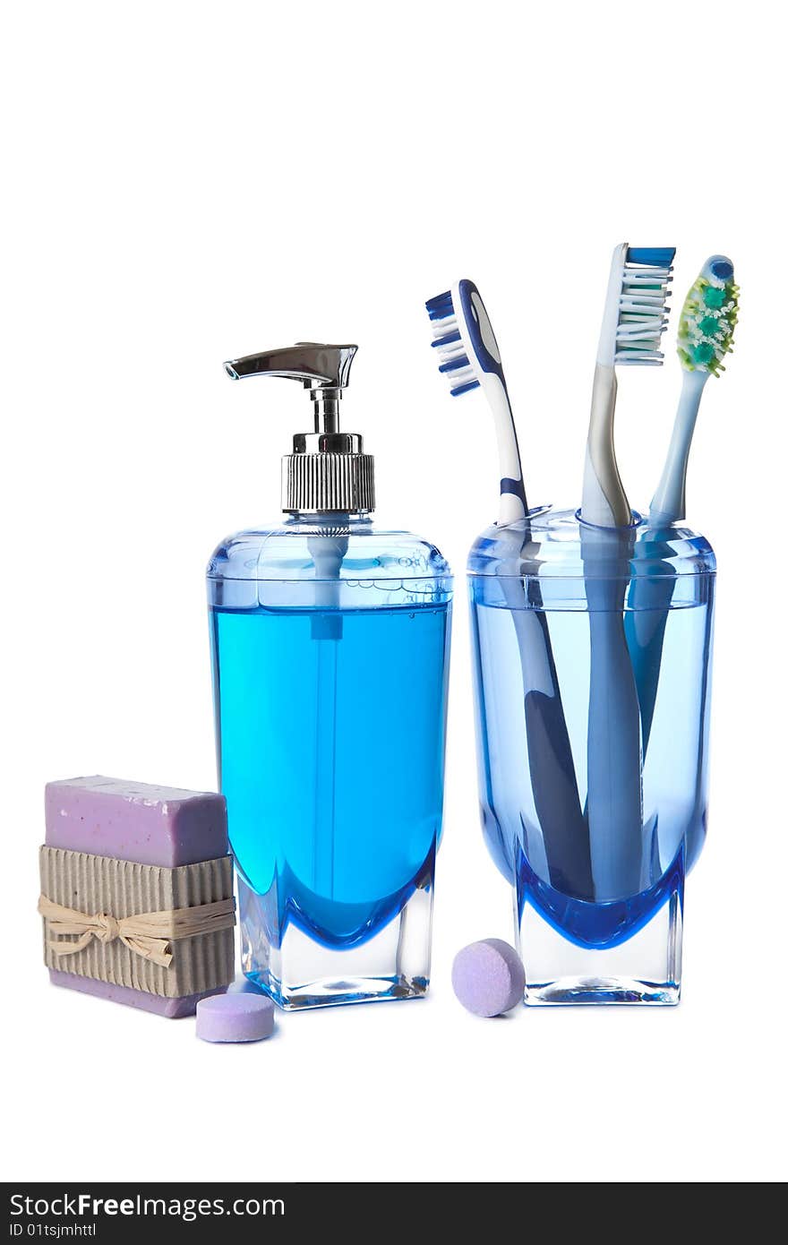 Soap and toothbrushes isolated over white