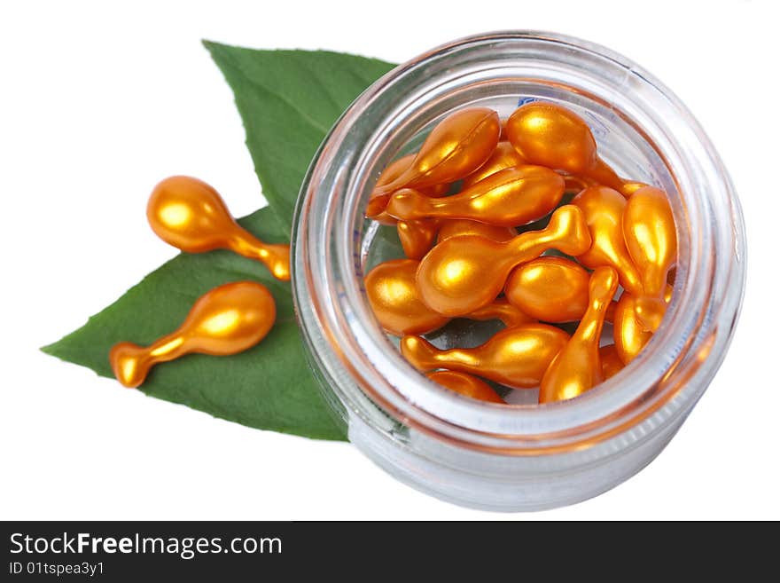 Cosmetic Capsules In Glass Bottle Isolated