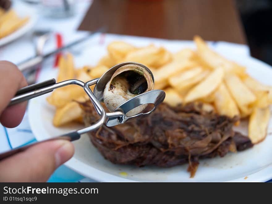 Frencn meal with beef and golden potato fries. Frencn meal with beef and golden potato fries