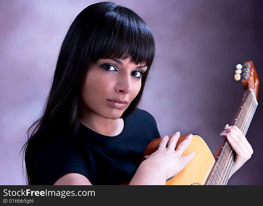 Beautiful Woman Playing Guitar