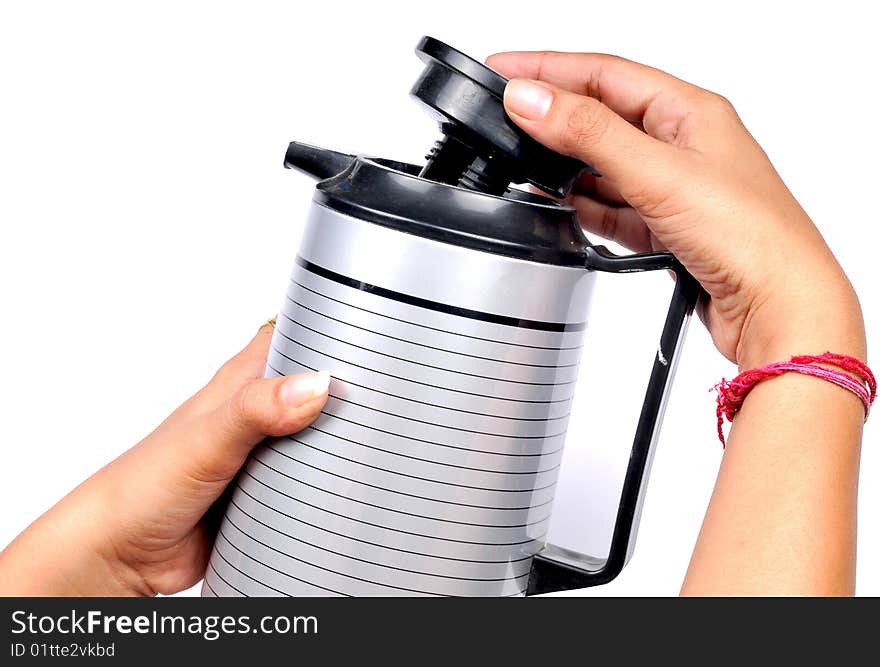 Female hands putting  the kettle lid. Female hands putting  the kettle lid.