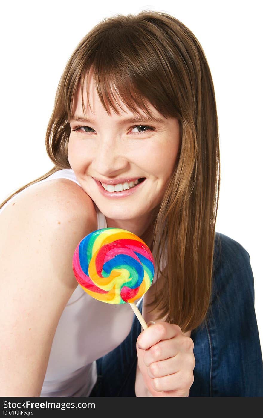 Portrait of teenage girl holding big lollipop