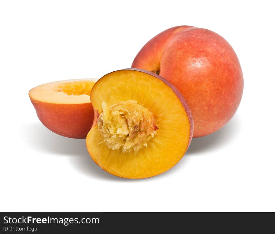 Ripe nectarines closeup, isolated on white