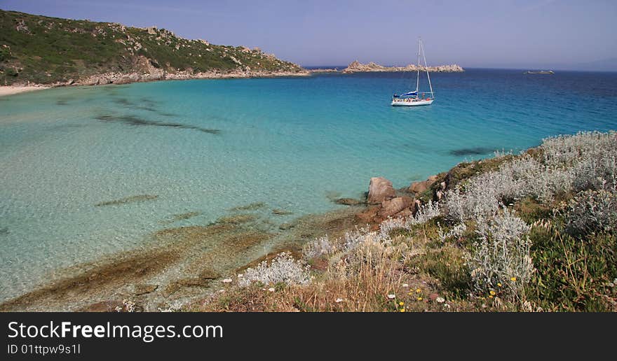 Boat sails in turquoise water