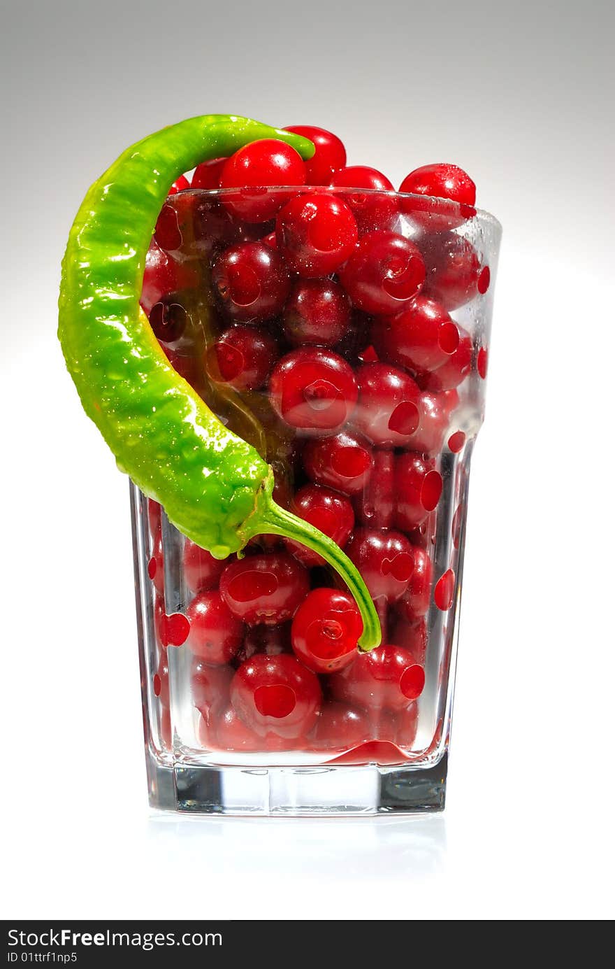 Sweet cherries and pepper in high glass