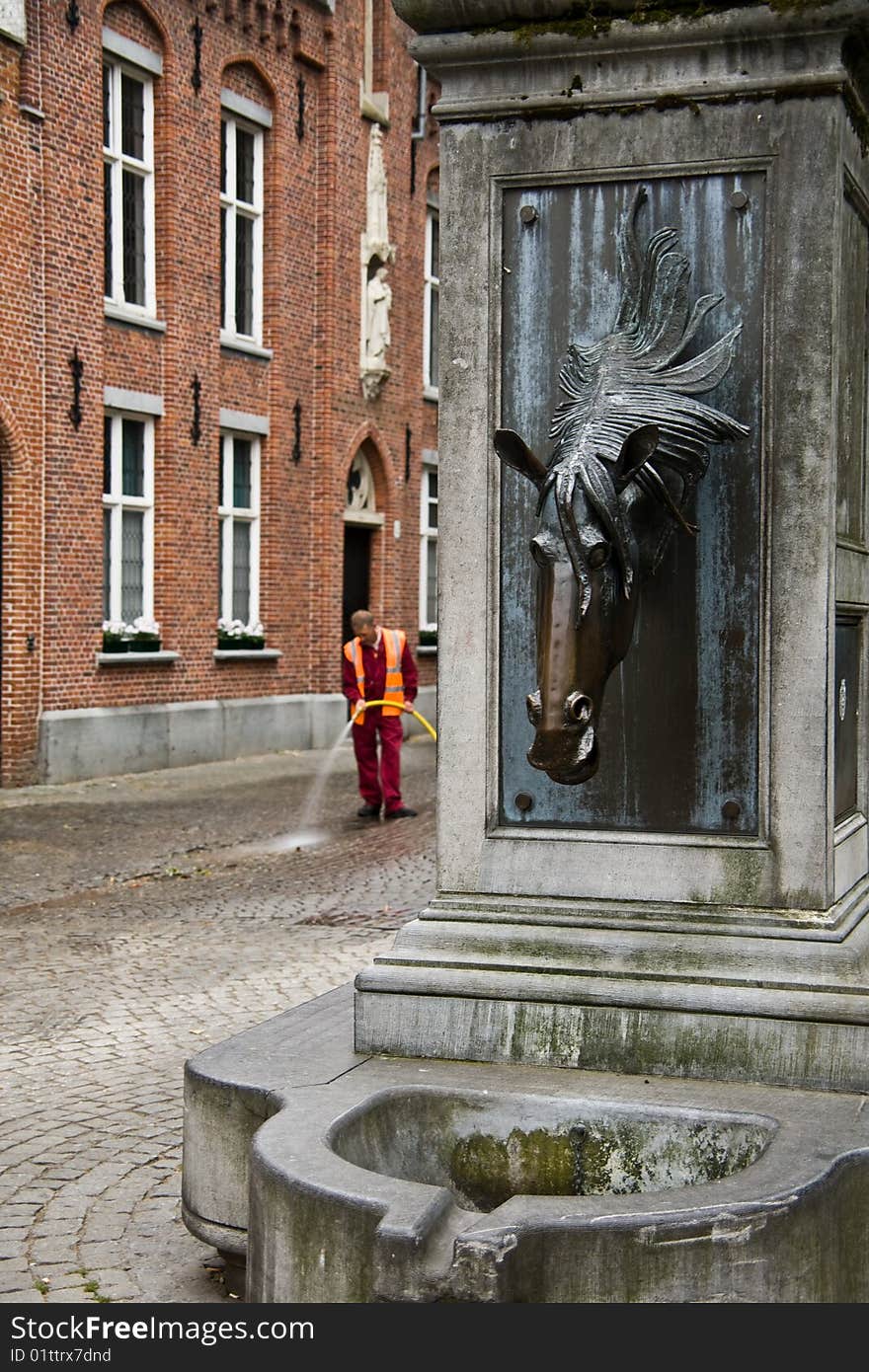 Brugge. Morning in a city begins with cleaning of streets