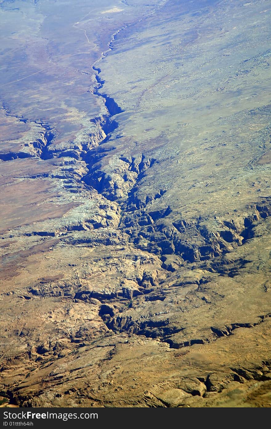 Arid valley in rocky mountains aerial view