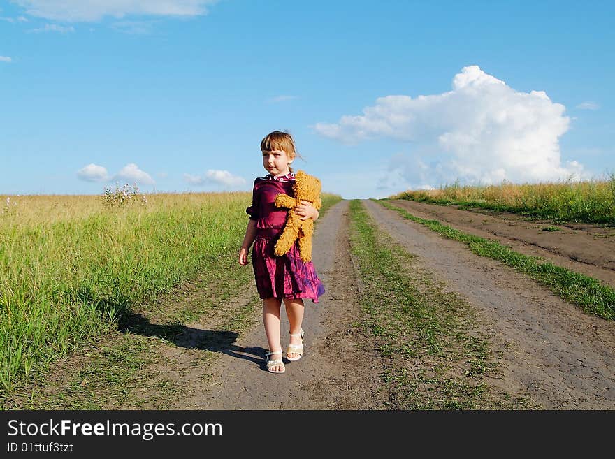 The lonely girl on a farmer field