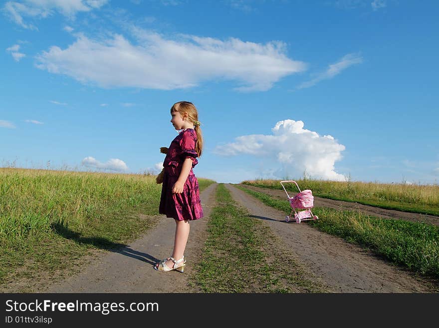 The lonely girl on a farmer field