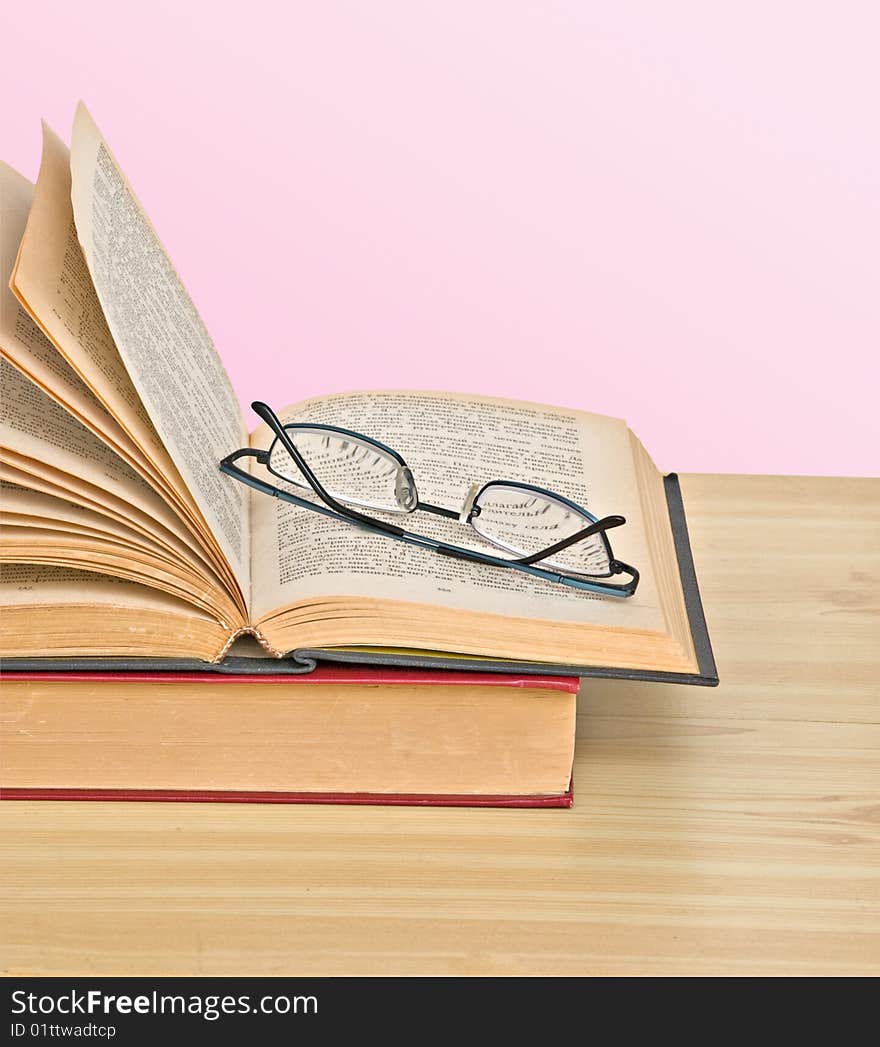 Glasses on open book