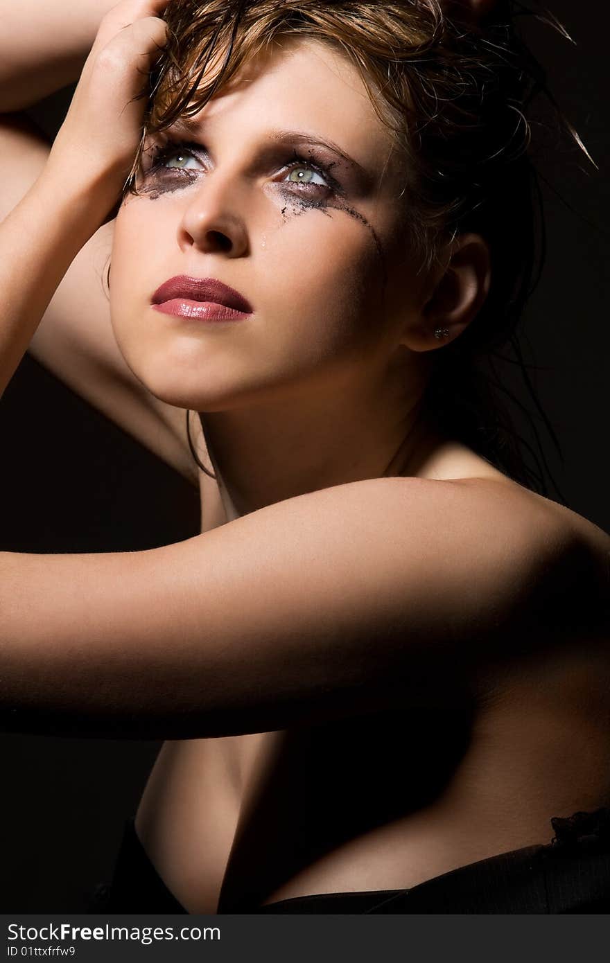 Sensual young woman with tears traces on her face. Sensual young woman with tears traces on her face