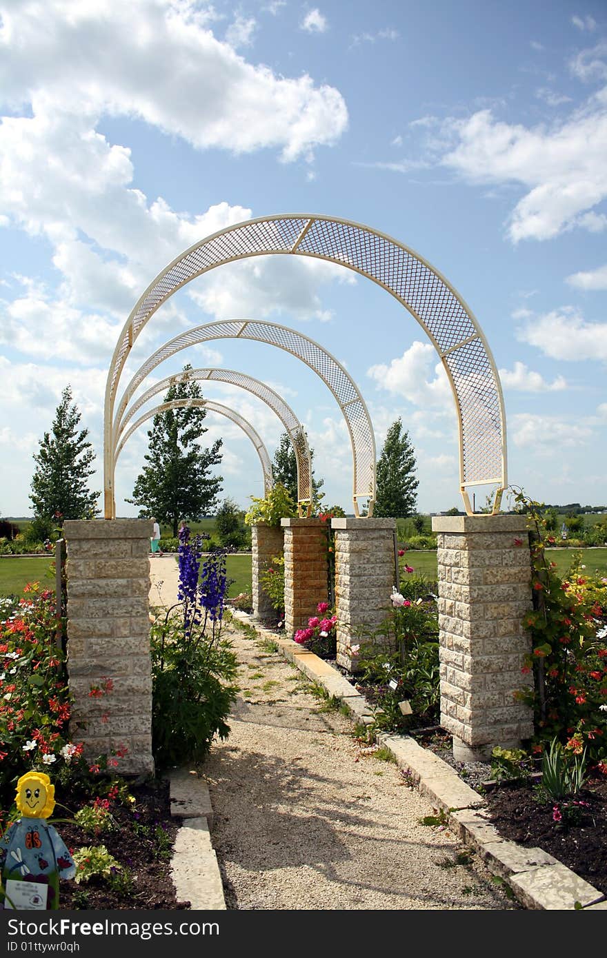 Arches and a pathway in a garden. Arches and a pathway in a garden.