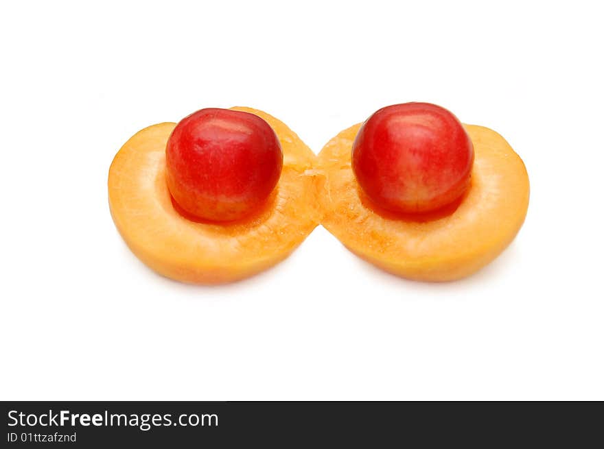 Apricot and sweet cherry on a white background